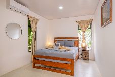 Queen bedroom with air conditioning at Villa Amanda  in Playa Negra, Puerto Viejo.